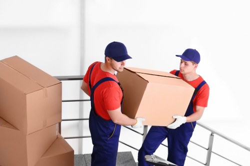 Removal van and moving boxes outside an Edgware property