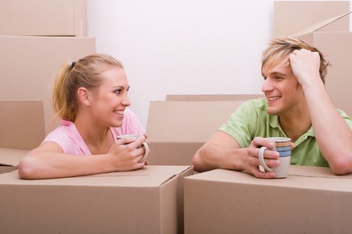 Students moving boxes during removals in Edgware