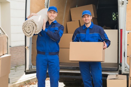 Workers using moving equipment to reduce manual handling risks