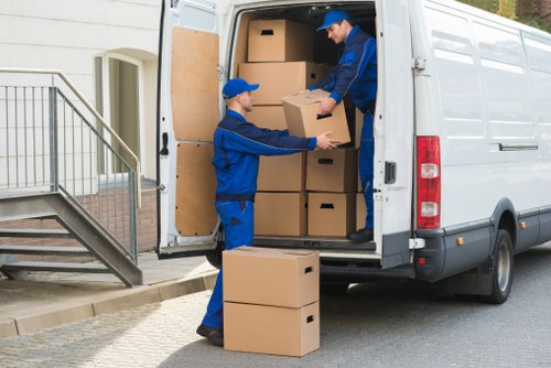 Packing and removals team preparing household items for transport
