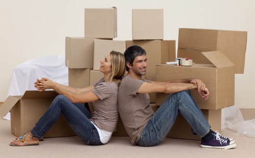 Professional movers handling furniture during a last minute move