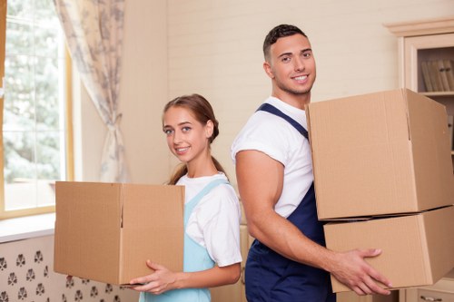 Professional movers handling furniture removals in Edgware on a local street