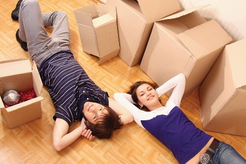 Professional movers handling items during a scheduled relocation