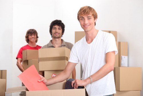 Moving team assessing a service issue with paperwork