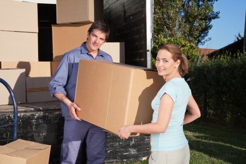 Estimator reviewing a load-based removals quote for a local move